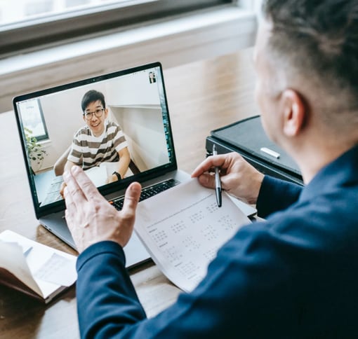 A teacher and his student in a virtual classroom